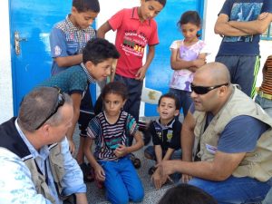 Mohammed El Halabi (right) engaging with Gazan children in better times